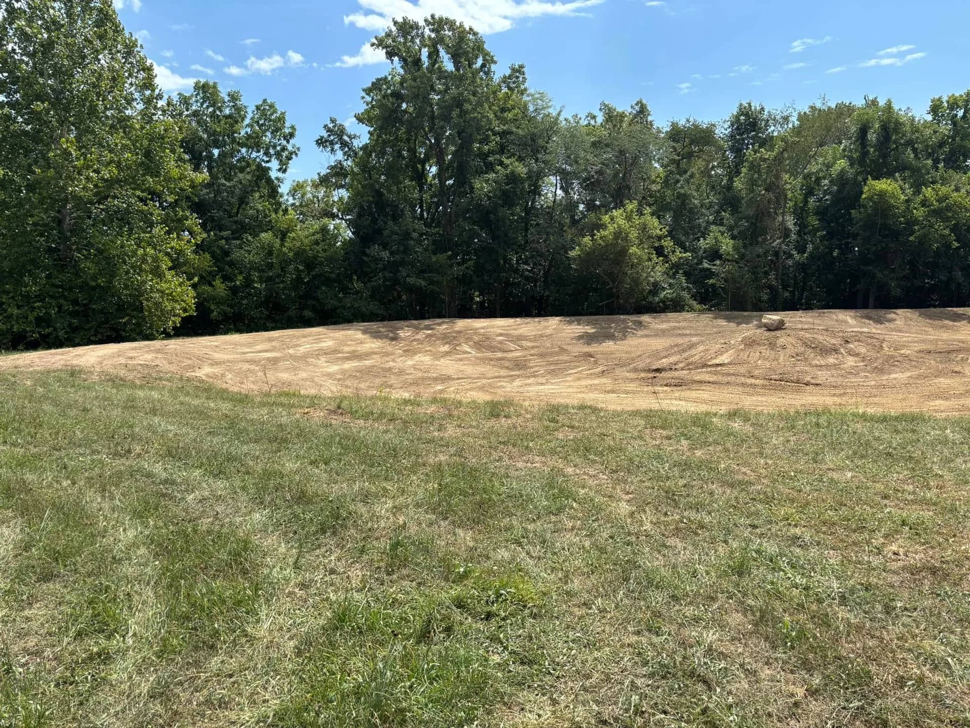 Rough-graded building site after clearing and site preparation