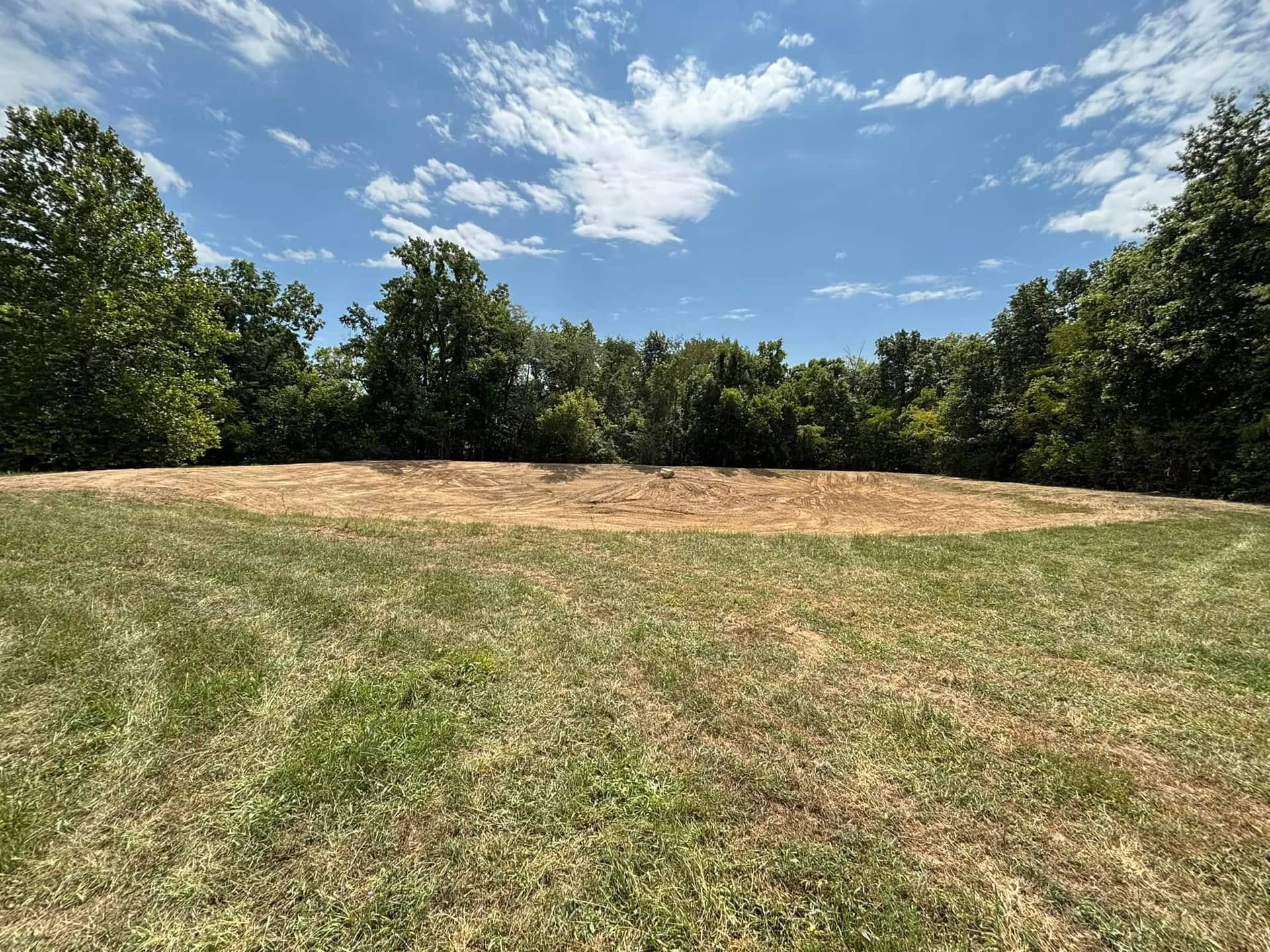 Graded field under a blue summer sky
